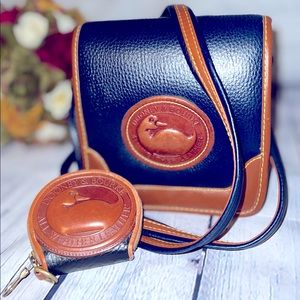 Classic Dooney & Bourke two tone crossbody bag in navy blue with coin purse